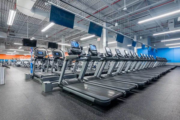 Blink Fitness interior with the brand's bold accent wall