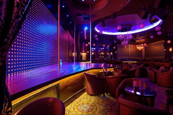 Booth seating along the wall of an entertainment club