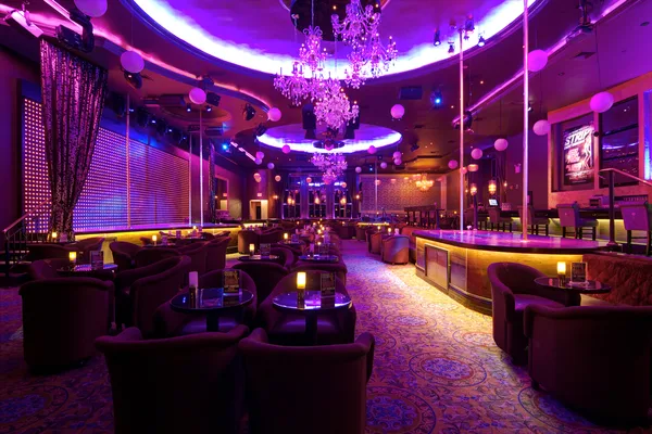 Wide view across the venue at full lighting design