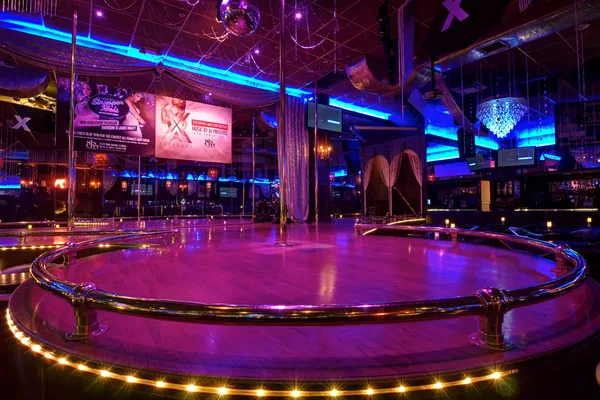 Exterior signage of a nightlife venue after dark