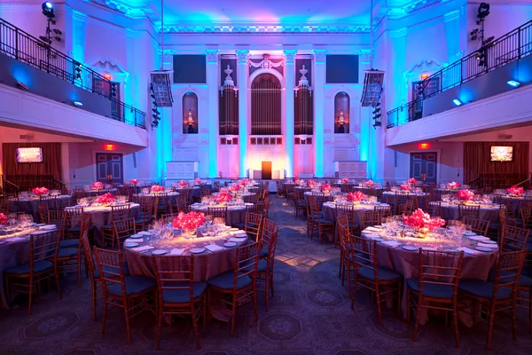 Ceremony seating arranged in rows toward an altar arch