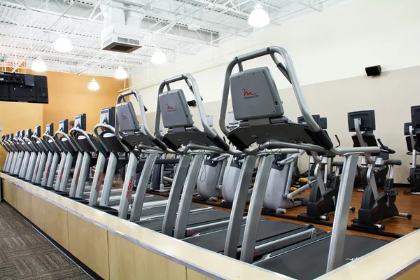 Functional training rig with attachments in the open zone