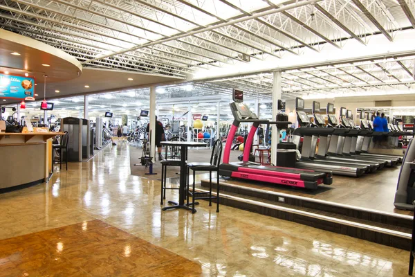 Brightly branded gym interior photographed wide