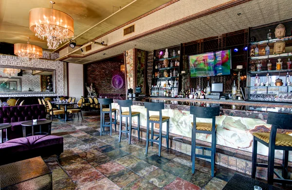 Evening exterior of a restaurant with interior glow