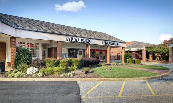 Mall entrance vestibule with brand tenants visible